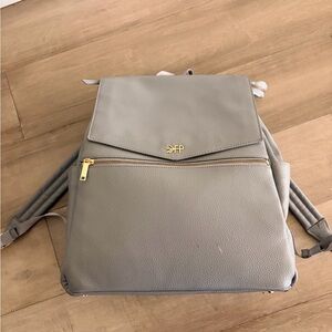 Freshly picked diaper bag with mat